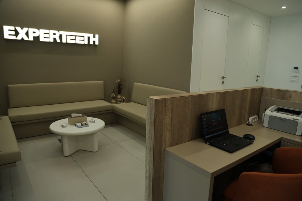 Experteeth waiting lounge with the clinic name on the wall